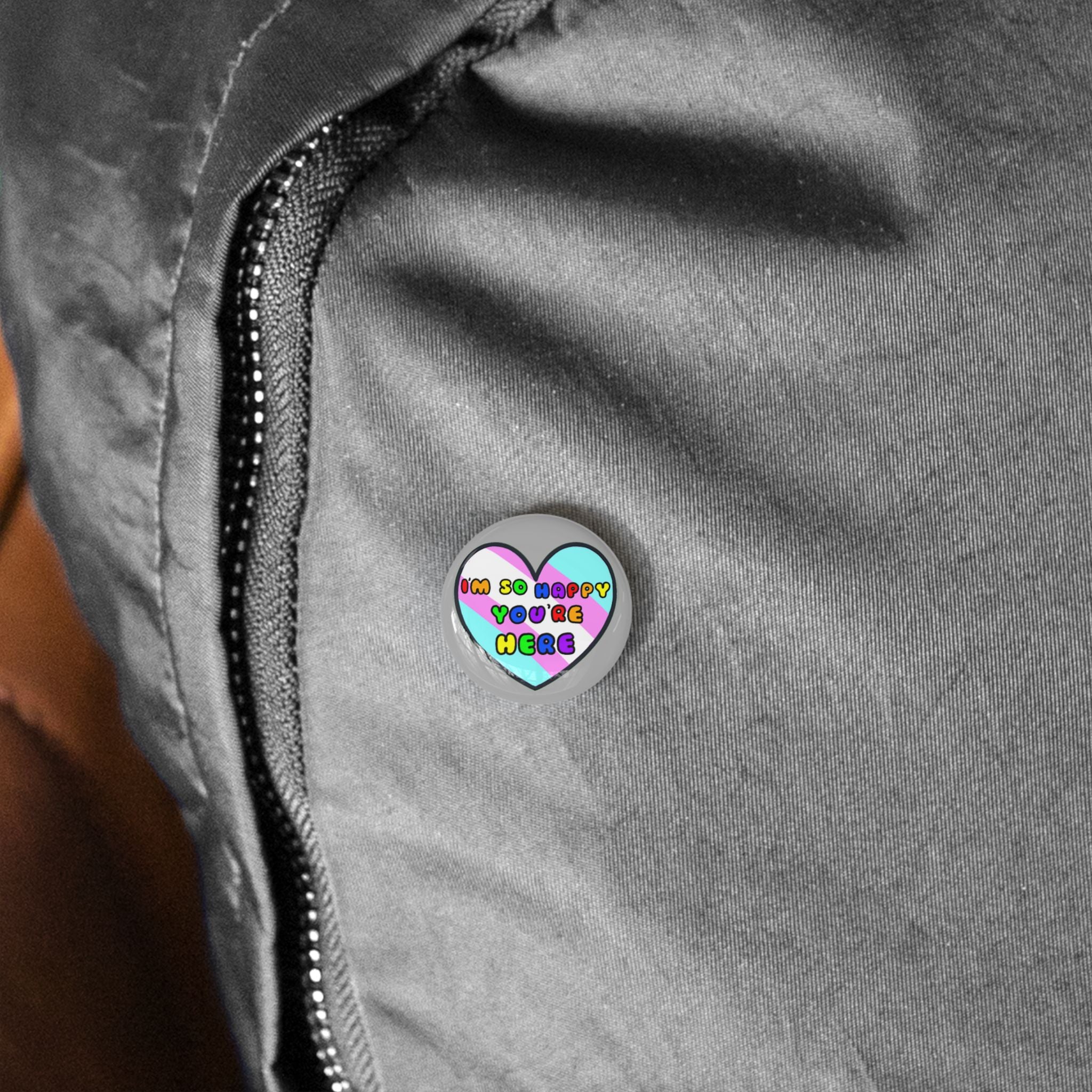 Round Pin — “I’m So Happy You’re Here” Colorful Heart Welcome Button